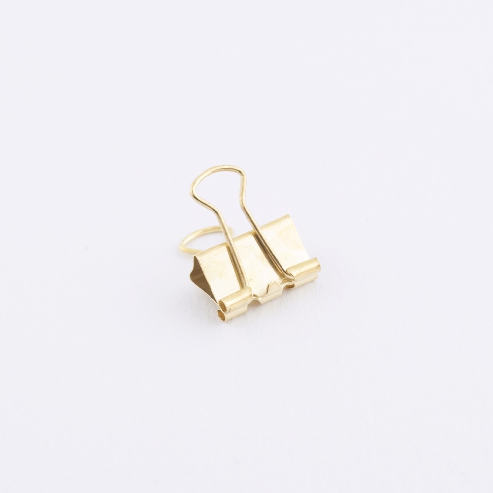 A golden binder clip